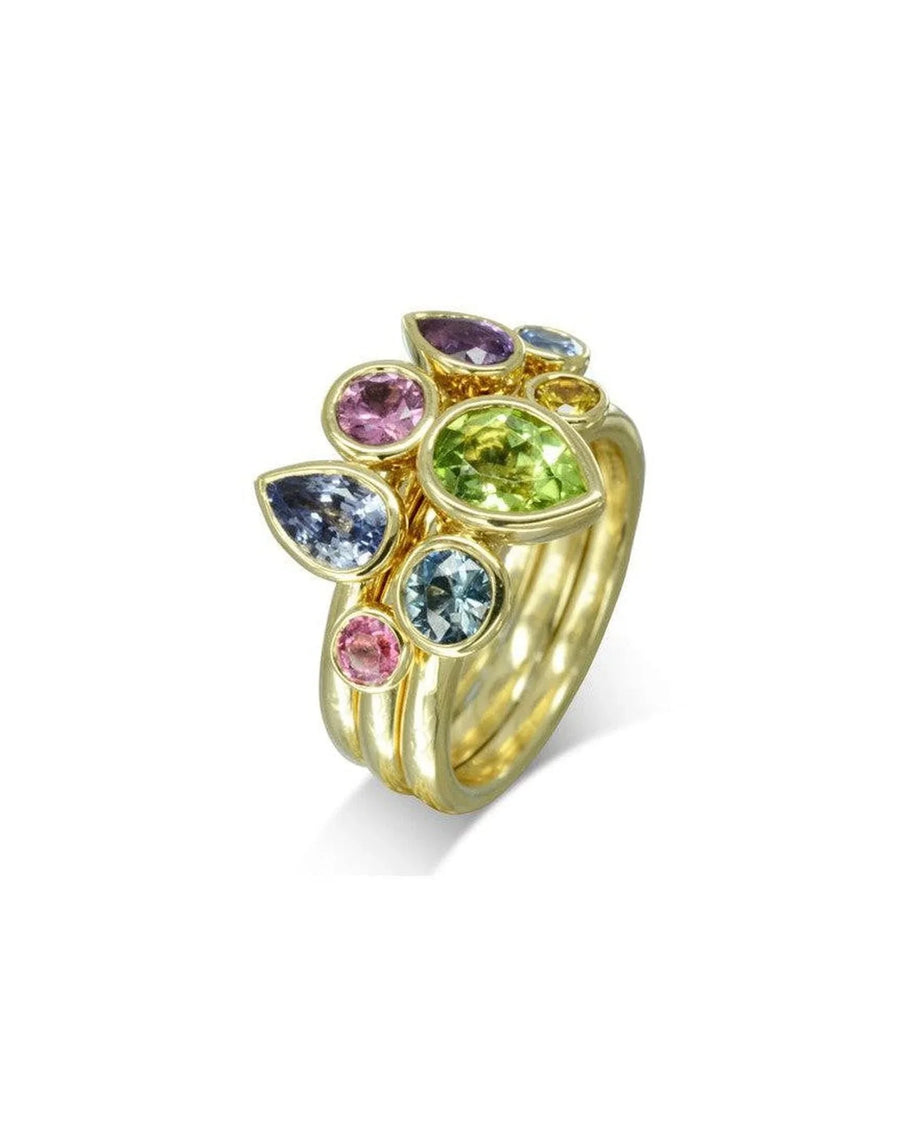 Gold stacking rings with multi-coloured pear-shaped sapphire gemstones.