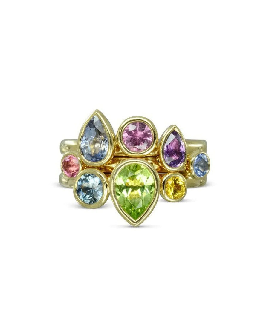 Gold stacking rings with multi-coloured pear and oval sapphires.