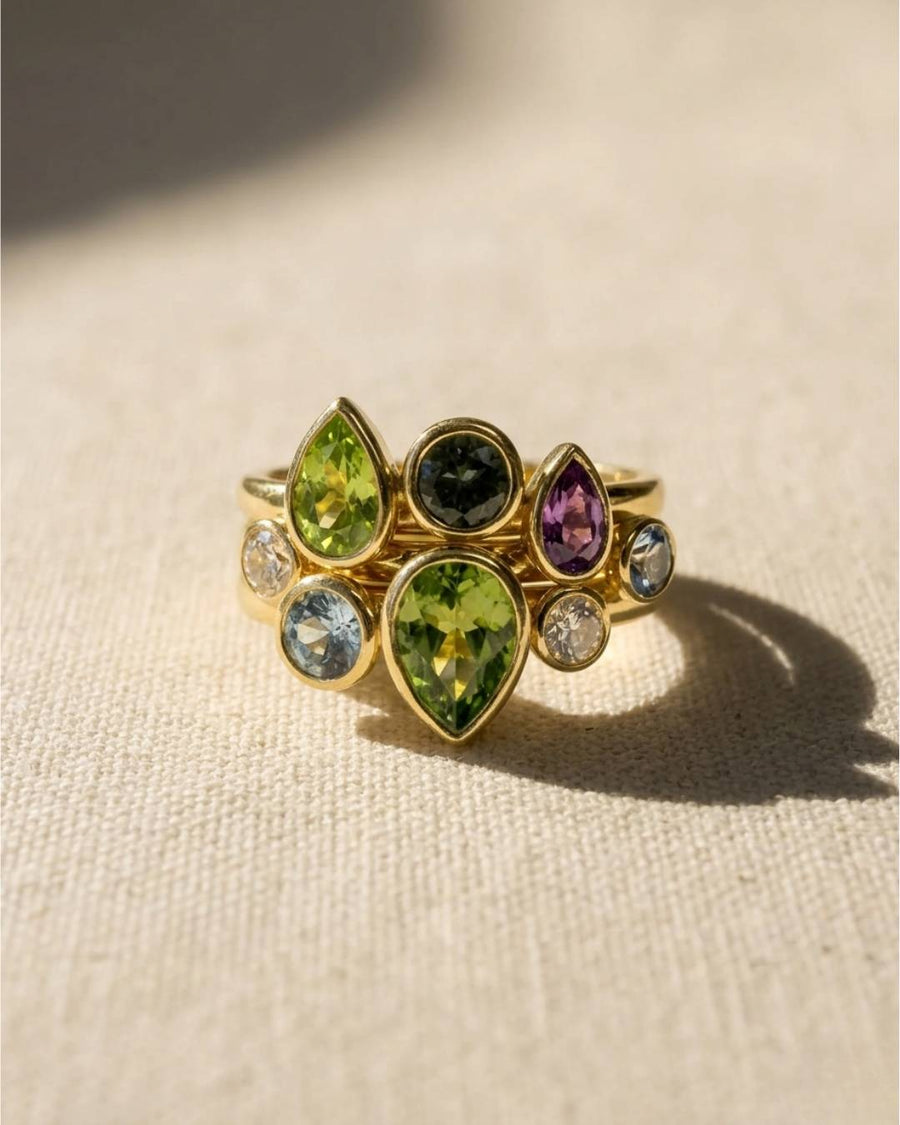 9ct yellow gold stacking rings with multi-coloured pear-shaped sapphires and round diamonds.