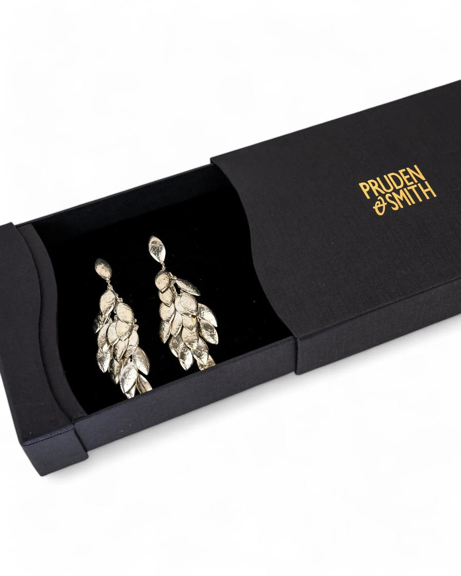 Silver multi-leaf long drop earrings in a black gift box.