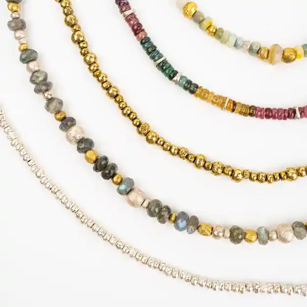 A selection of five hand-strung necklaces