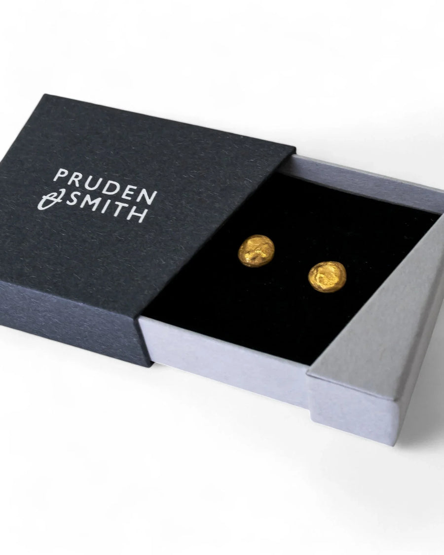 9ct yellow gold nugget stud earrings in an open black box.
