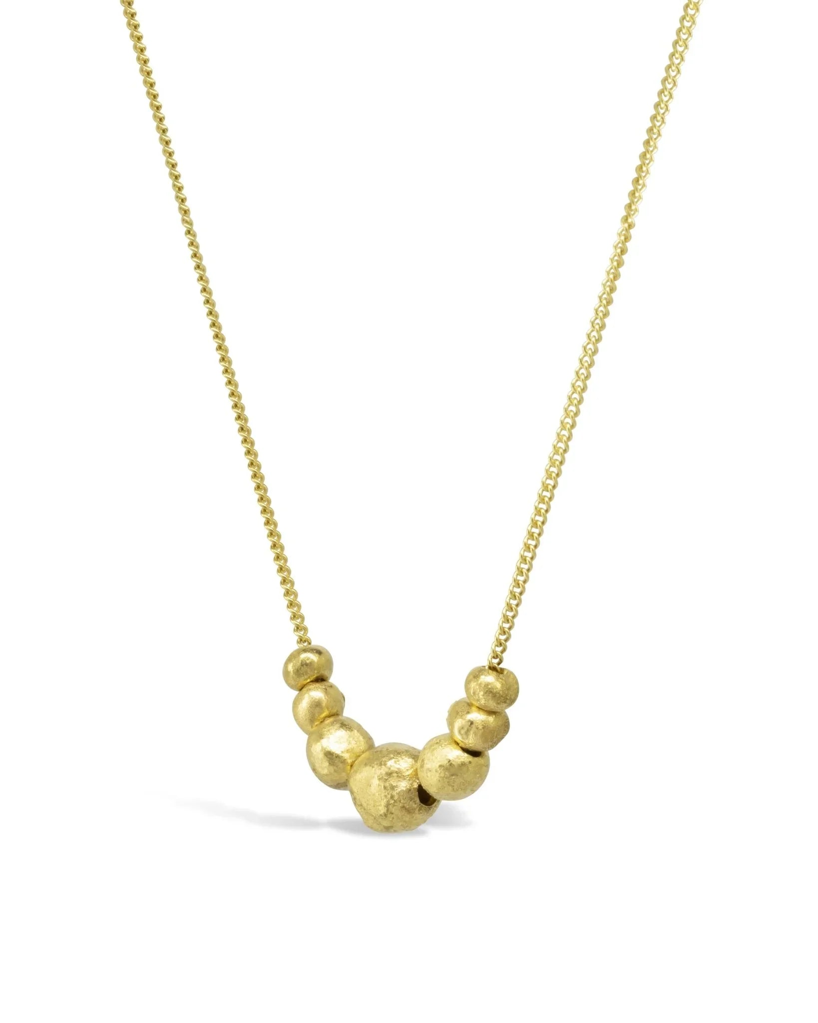 Gold nugget pendant necklace with organic textured beads on a fine gold chain