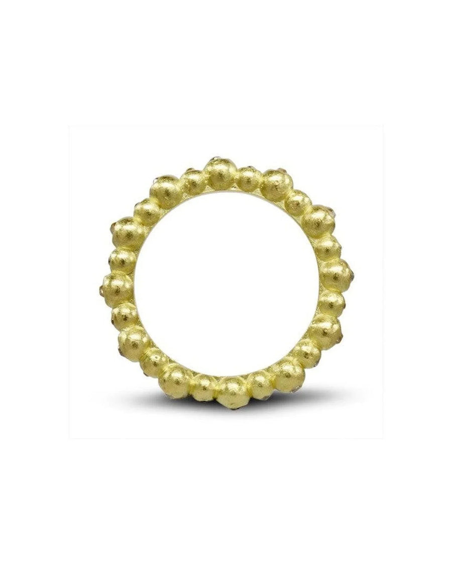 Yellow gold eternity ring with a dainty nugget design.