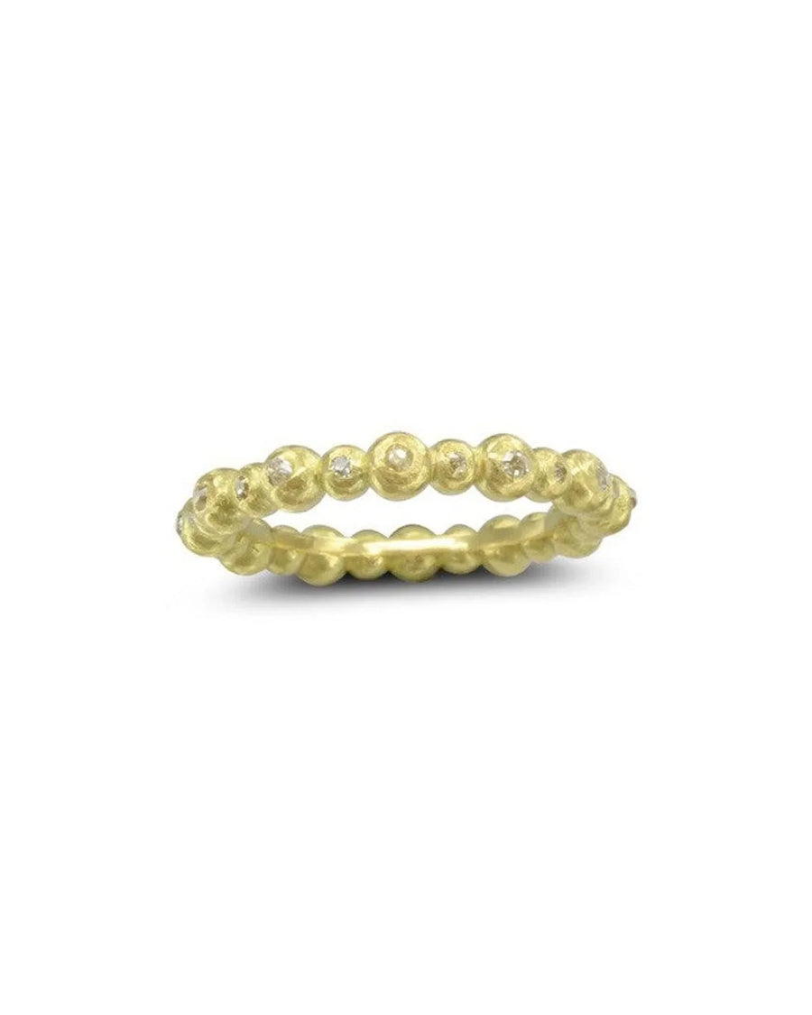 Yellow gold nugget eternity ring with dainty diamonds.