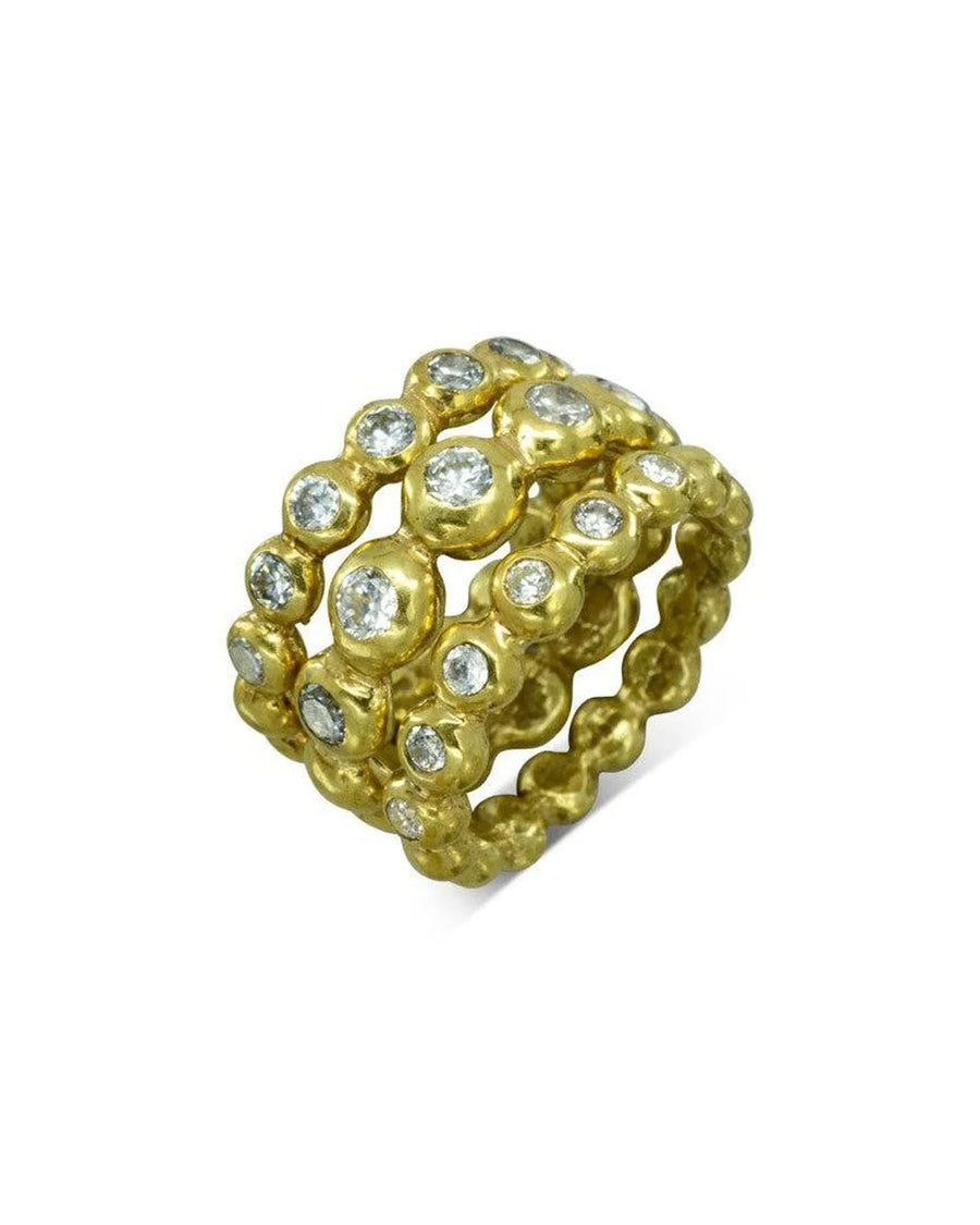 Gold stacking ring set with round nugget diamonds.