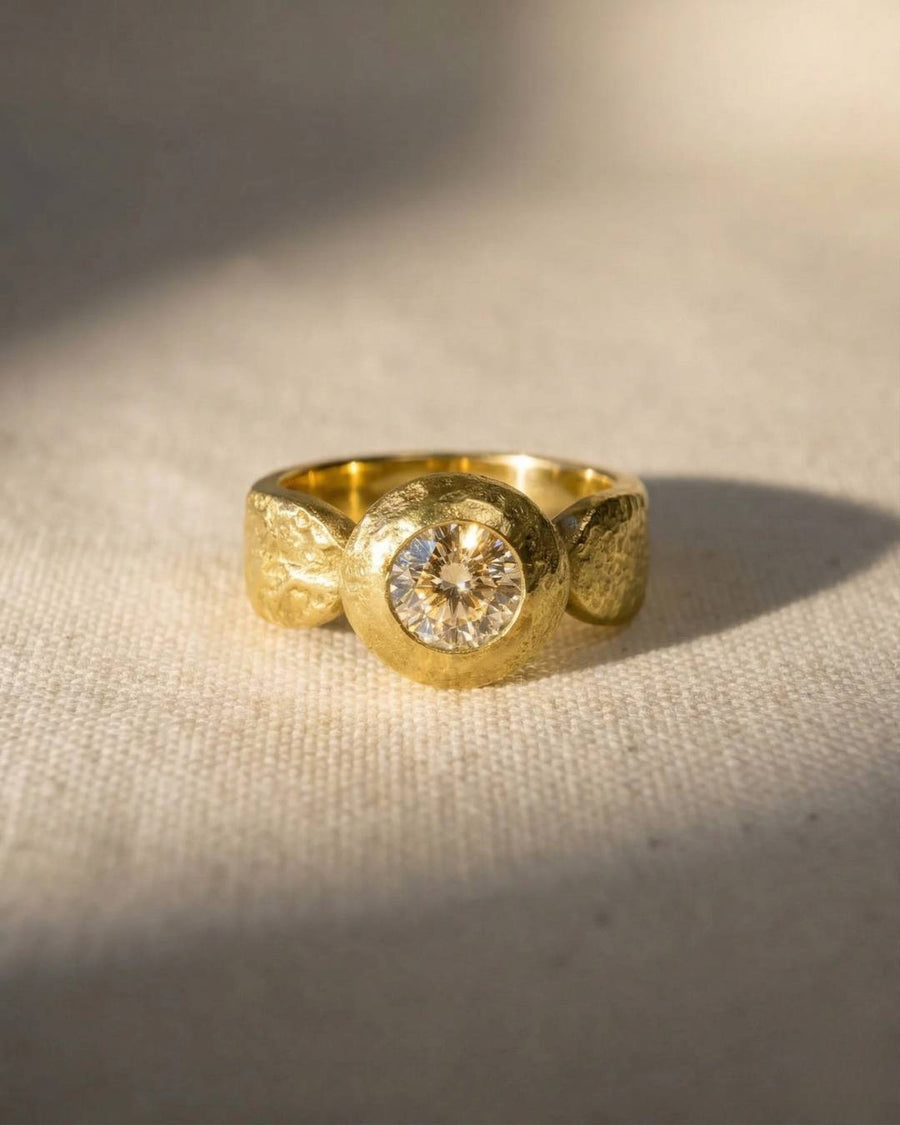 18ct yellow gold nugget ring with a round diamond.