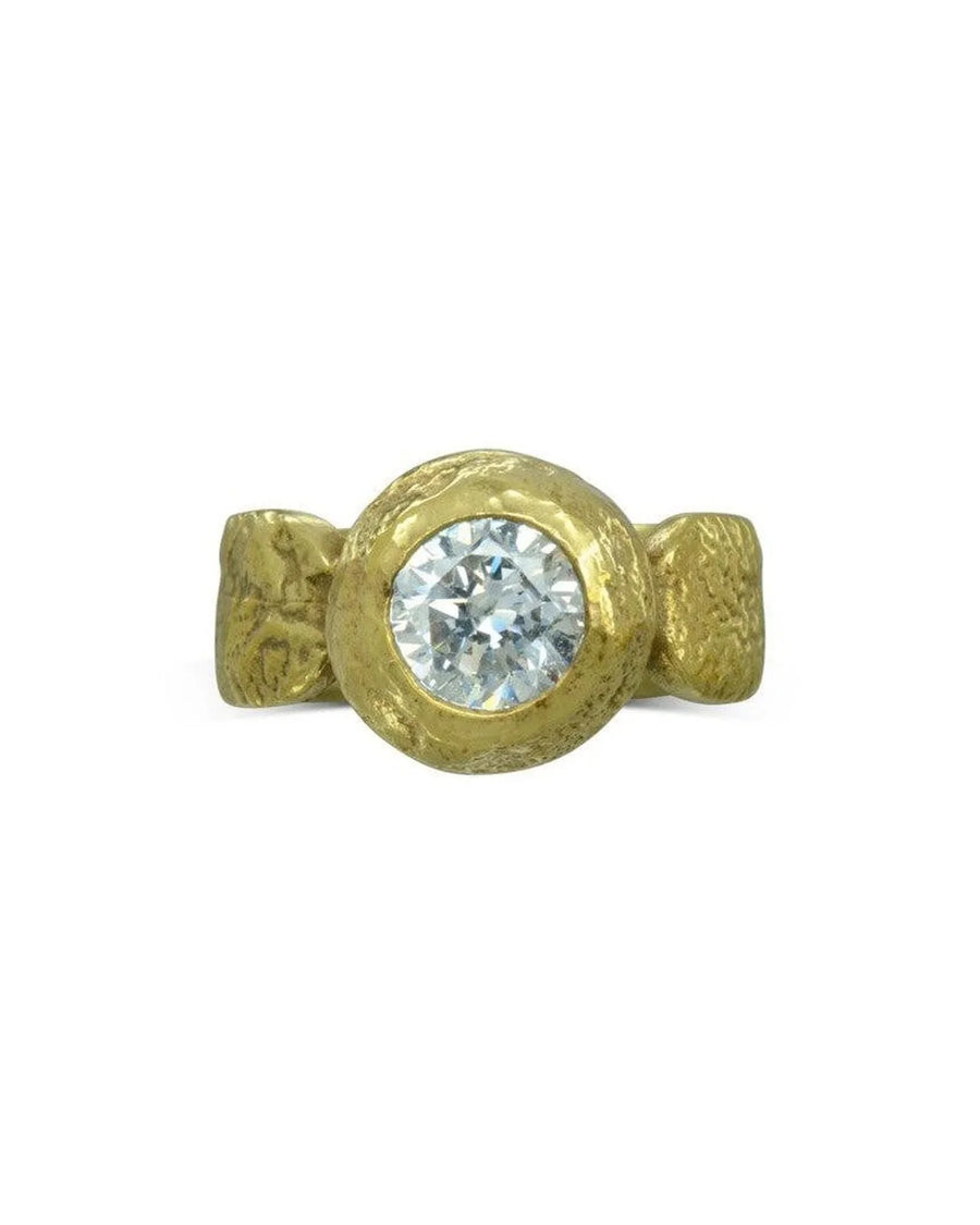 Gold nugget ring with a round diamond.