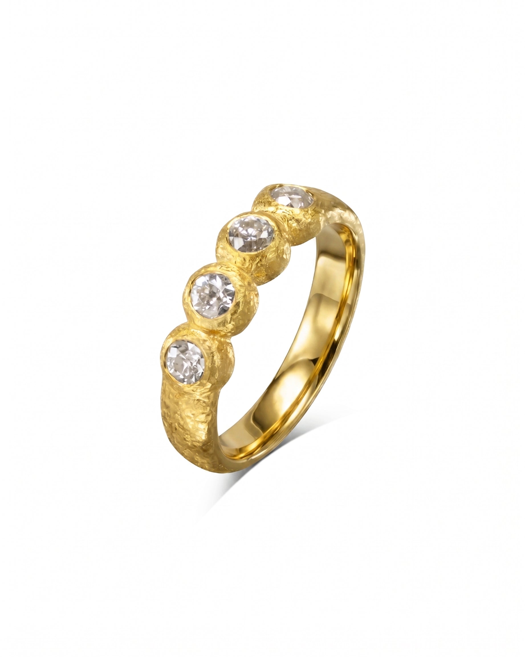 Gold nugget ring with four round diamonds.