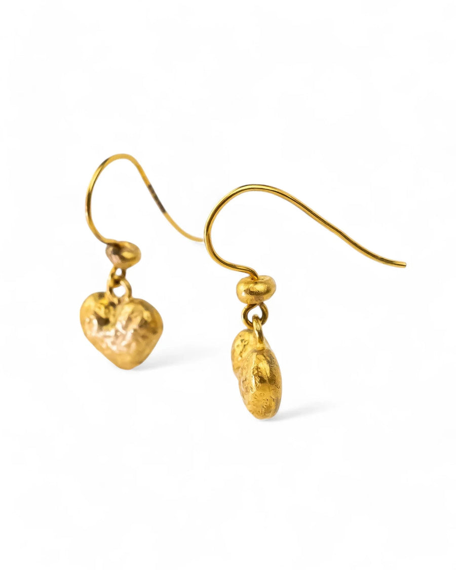 Gold nugget heart drop earrings on a white background.