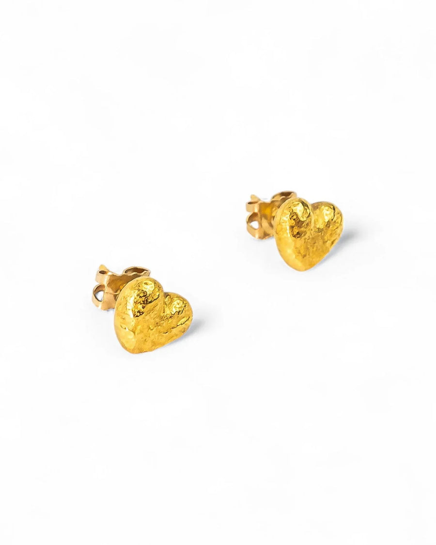 Nugget gold heart stud earrings with a textured finish.