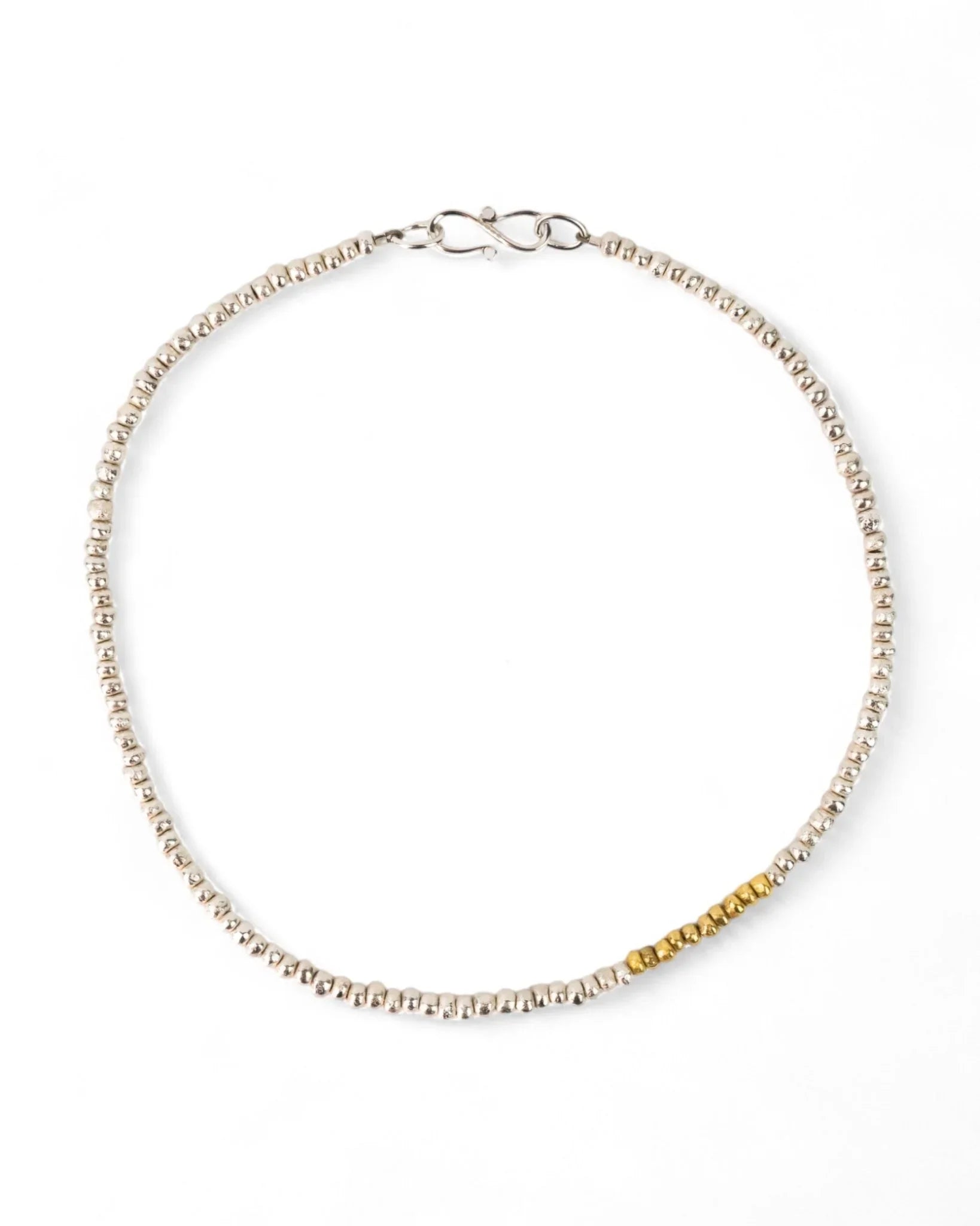 Handmade beaded silver necklace with gold nugget section, organic textured design