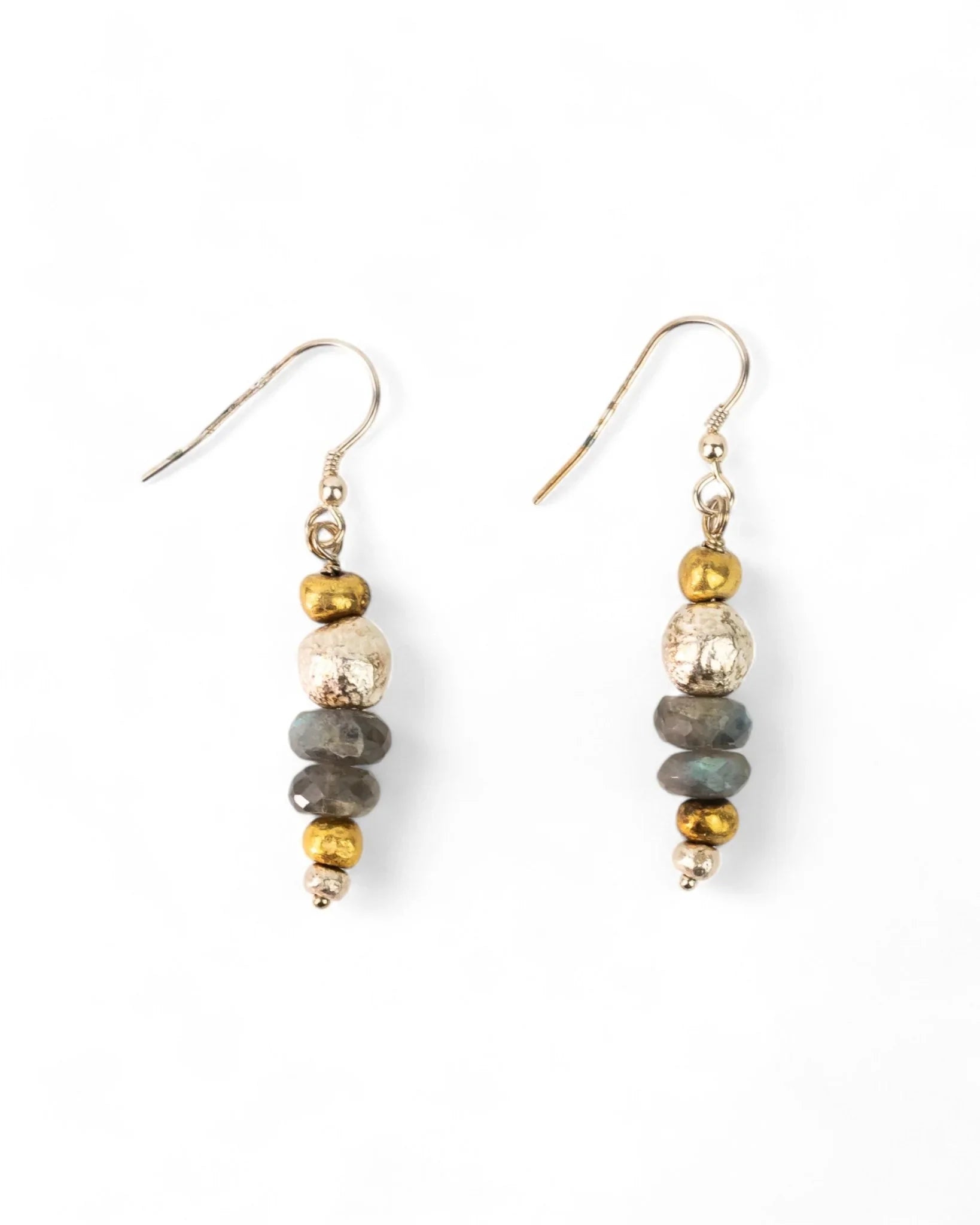 Dangly earrings with faceted gemstones and mixed metallic beads on white background