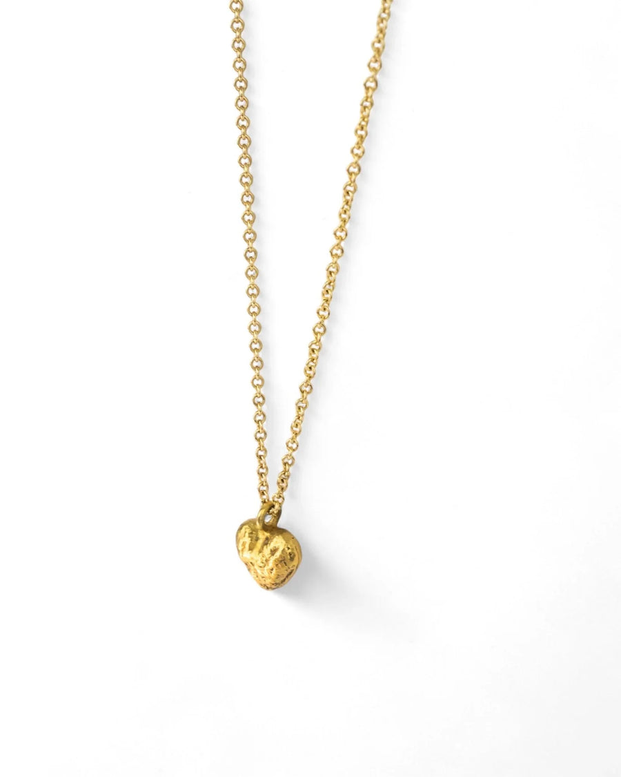 Gold nugget heart pendant on a delicate chain.