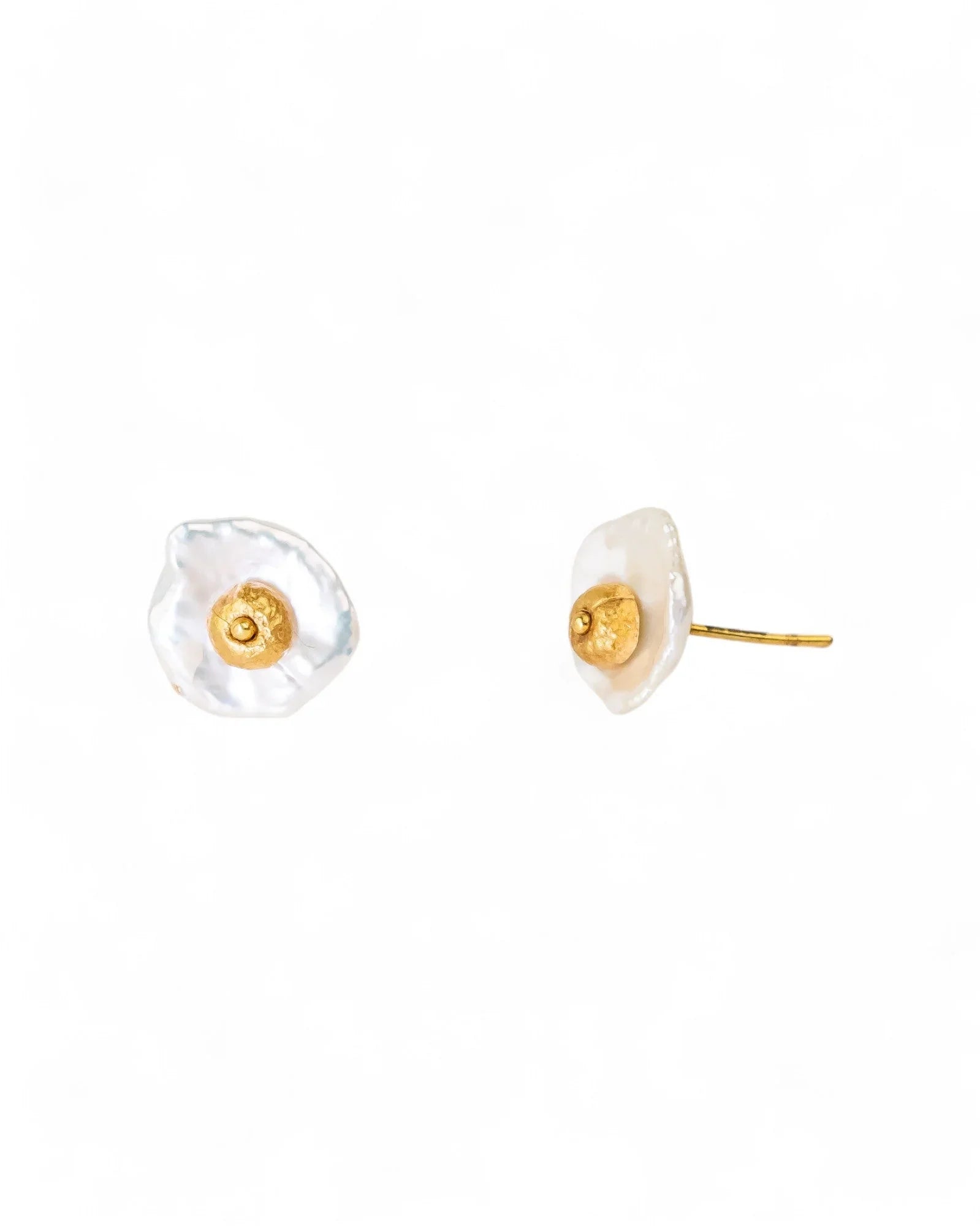 White keshi pearl stud earrings with a gold nugget center.