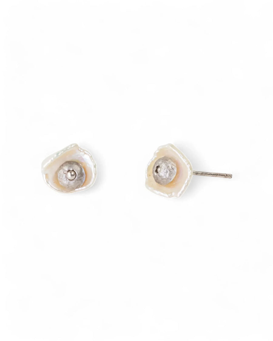 Two white nugget keshi pearl stud earrings with silver-toned centers.