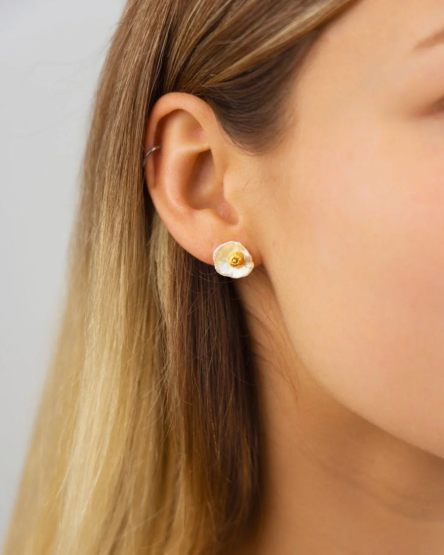 9ct yellow gold nugget keshi pearl stud earring on an ear.