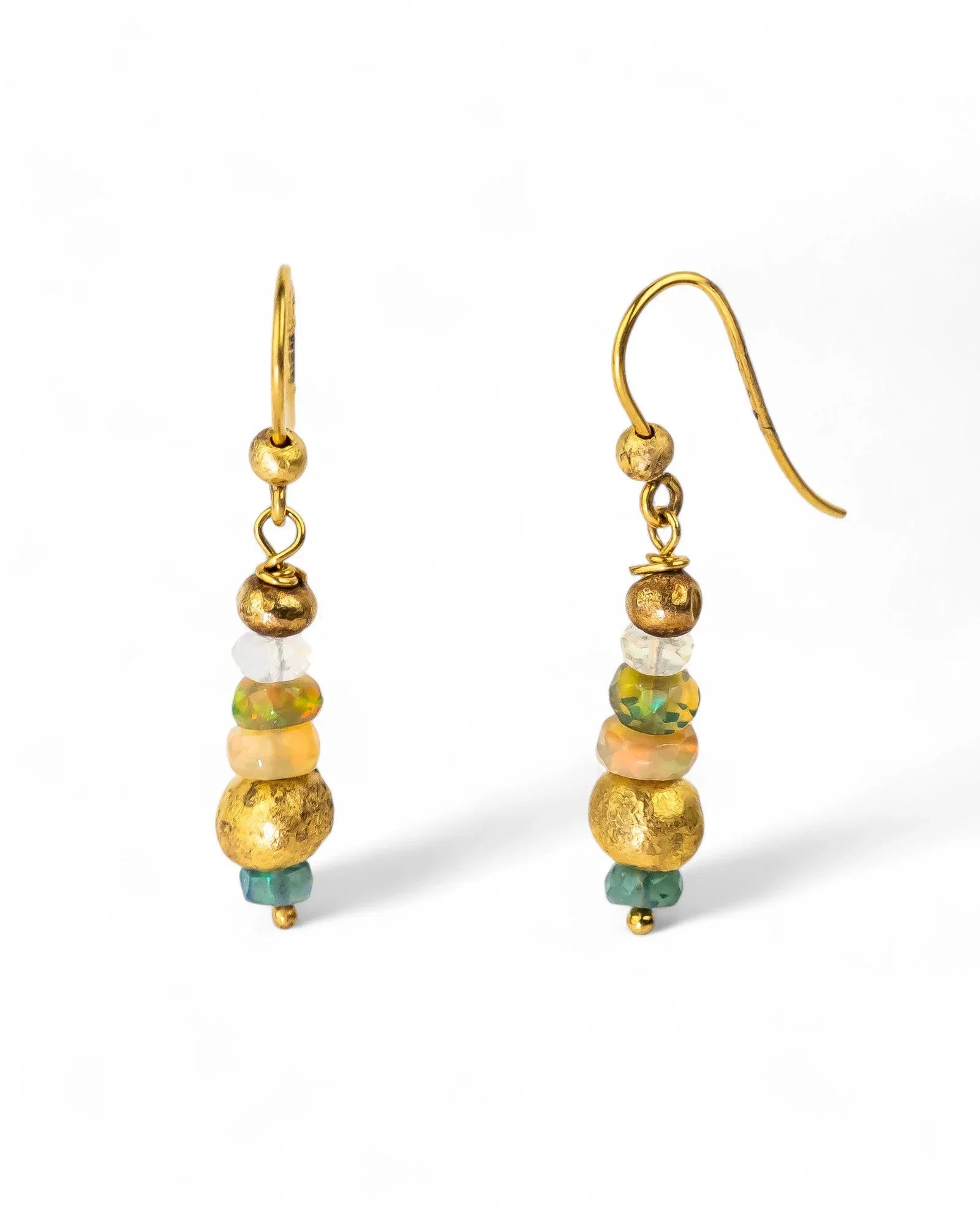 Dangly earrings with hammered gold and opal beads, green accents, on white background
