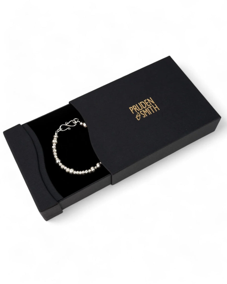 Handmade silver nugget bracelet with organic textured beads in a black gift box