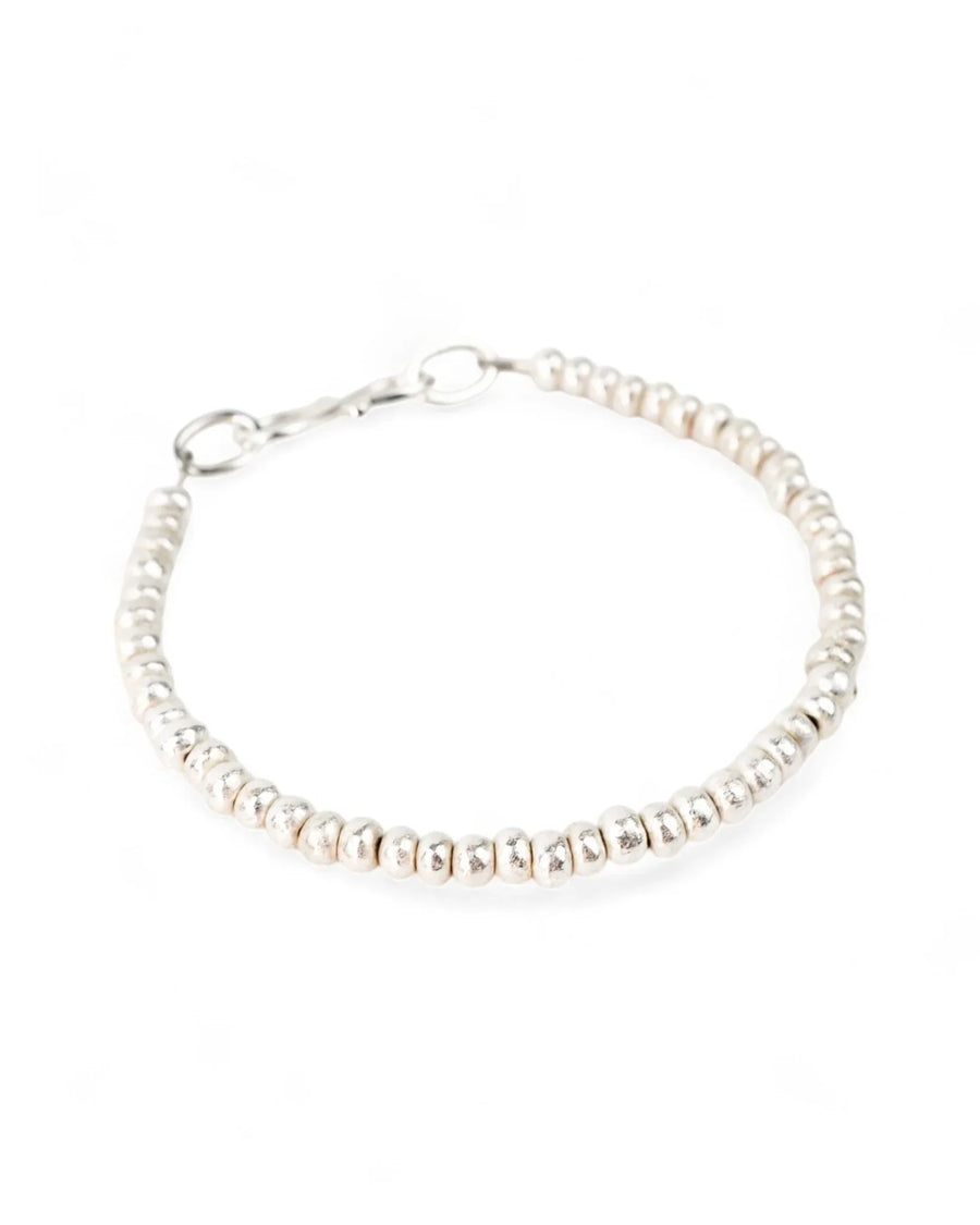 Handmade solid silver nugget bead bracelet with a lobster clasp on a white background