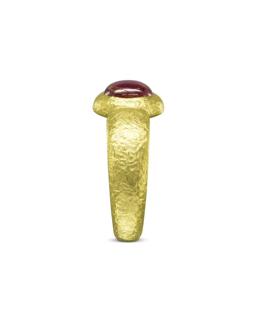 Nugget yellow gold ring with a cabochon ruby gemstone.