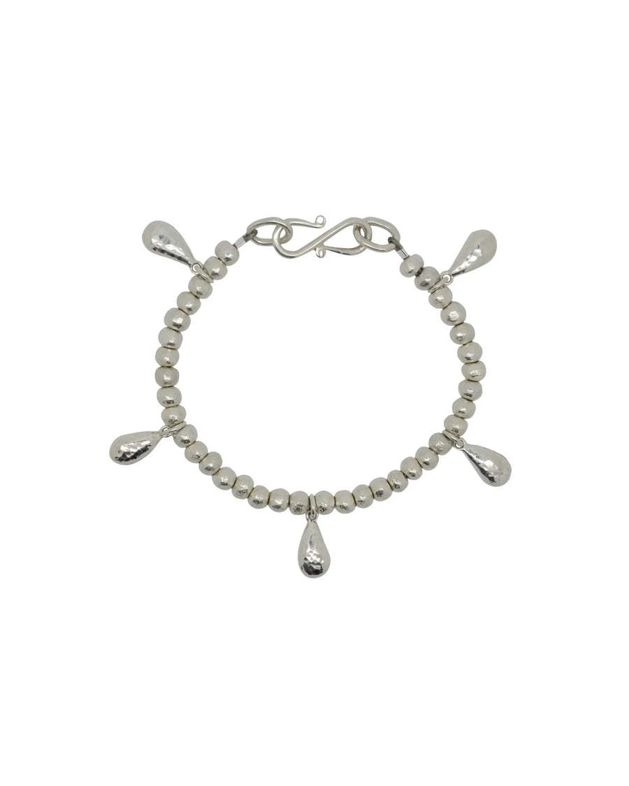Handmade silver bracelet with beaded band and hammered teardrop charms