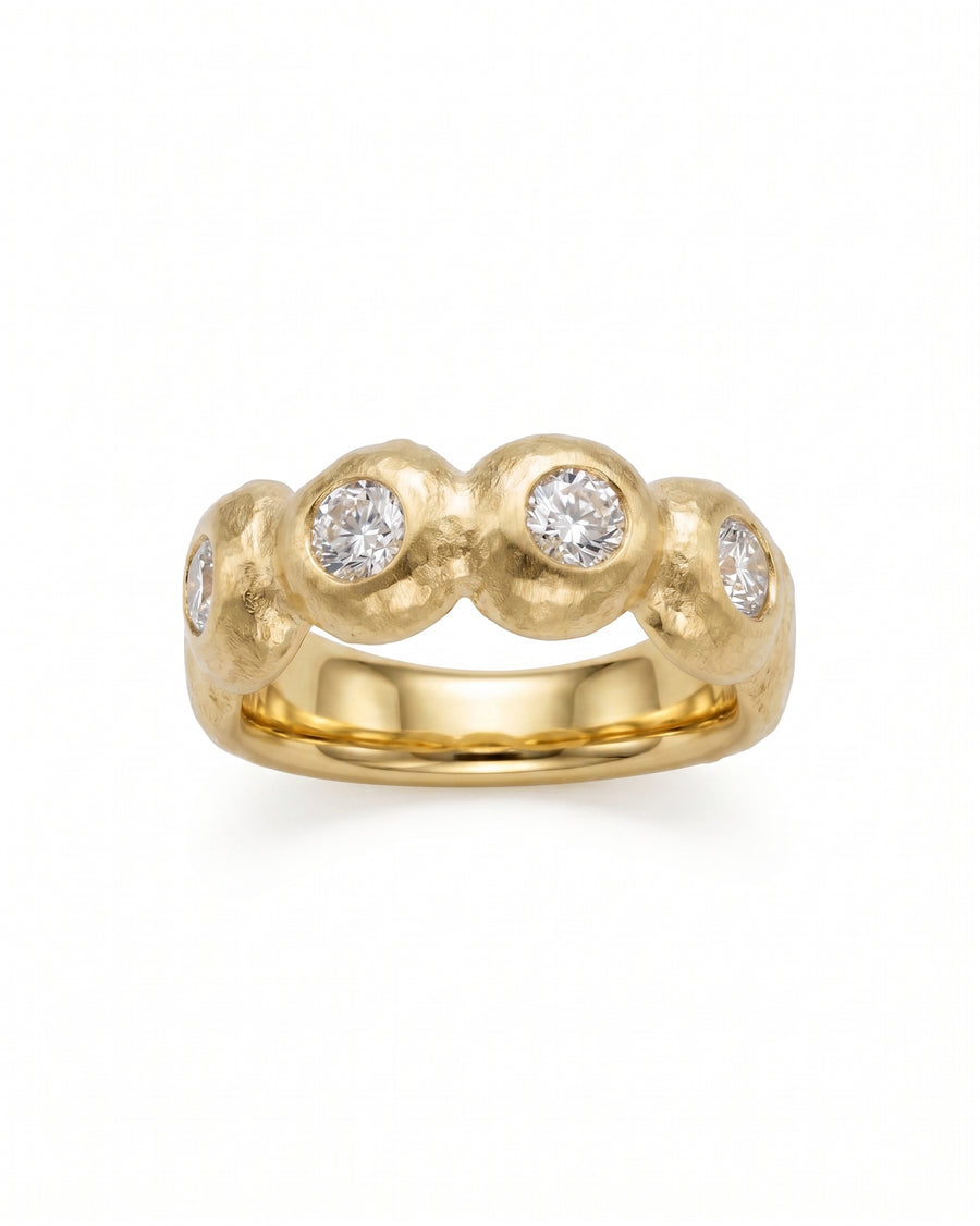 Nugget yellow gold eternity ring with five round diamonds.