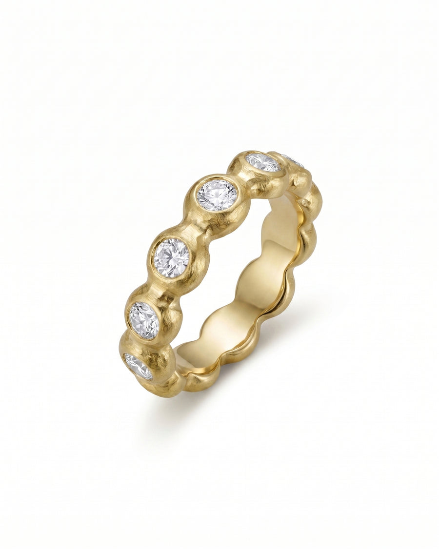 Nugget yellow gold full eternity ring with round diamonds, 6mm wide.