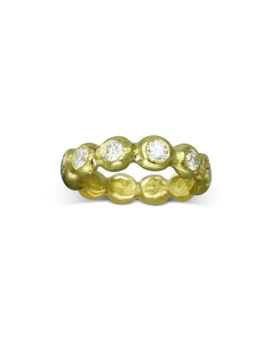 Nugget yellow gold full eternity ring with bezel-set diamonds.