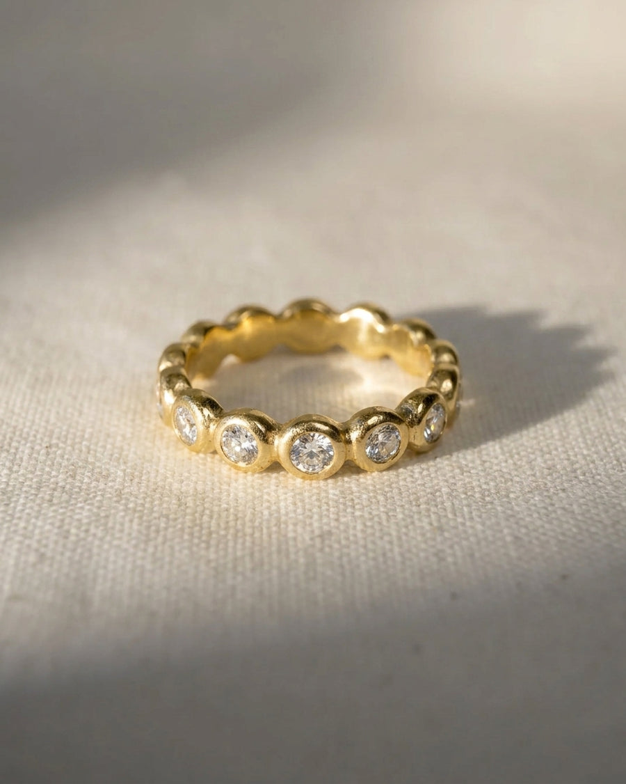 18ct yellow gold half eternity ring with 8 round diamonds.