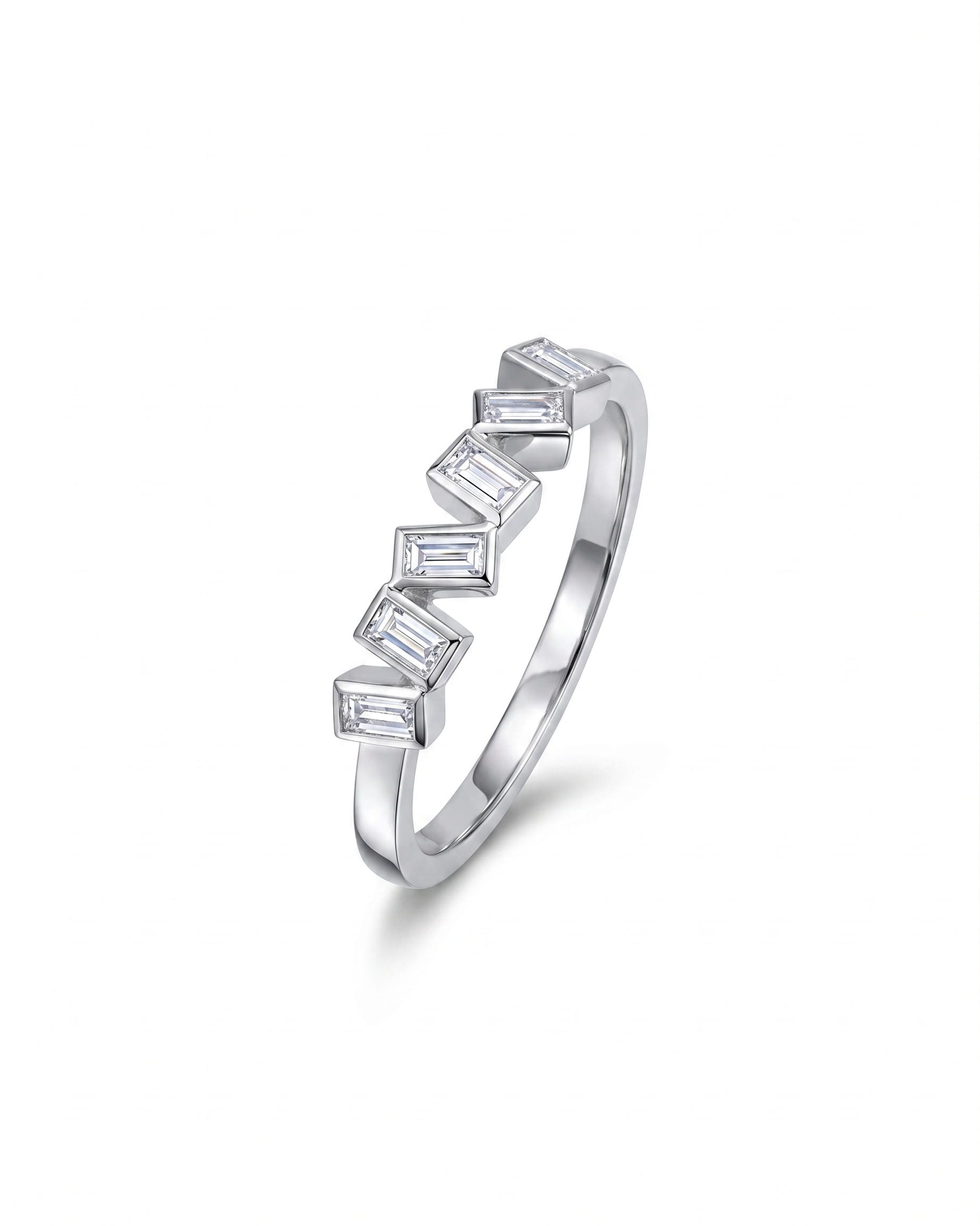 White gold half eternity ring with offset baguette diamonds.