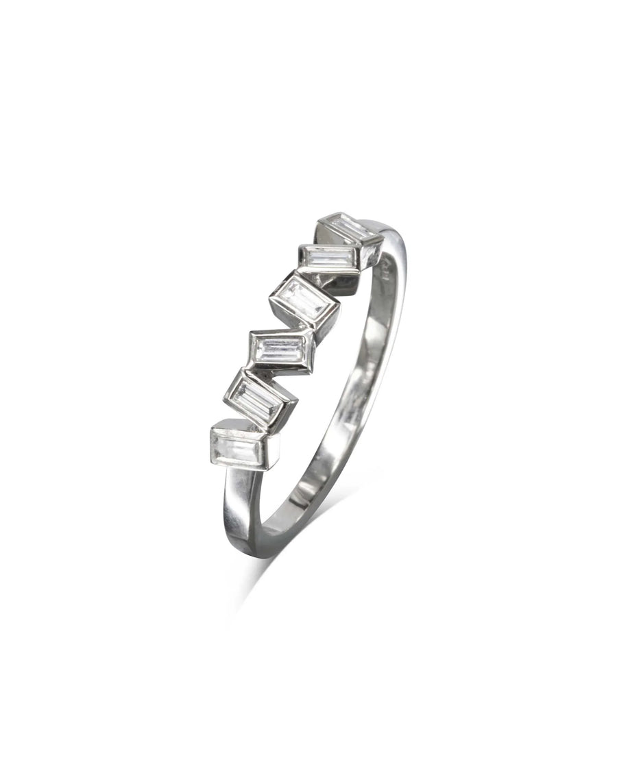 Silver half eternity ring with offset baguette diamonds.