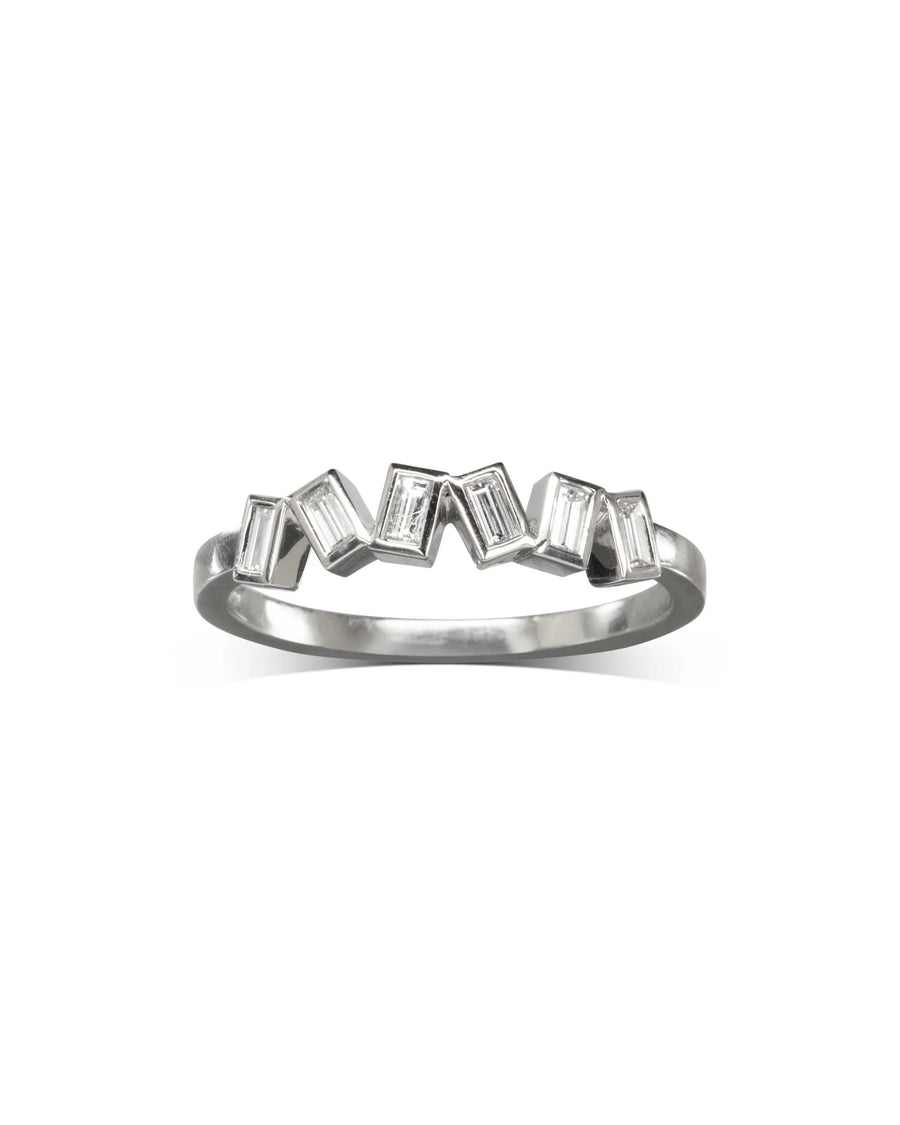 Silver half eternity ring with offset baguette diamonds.