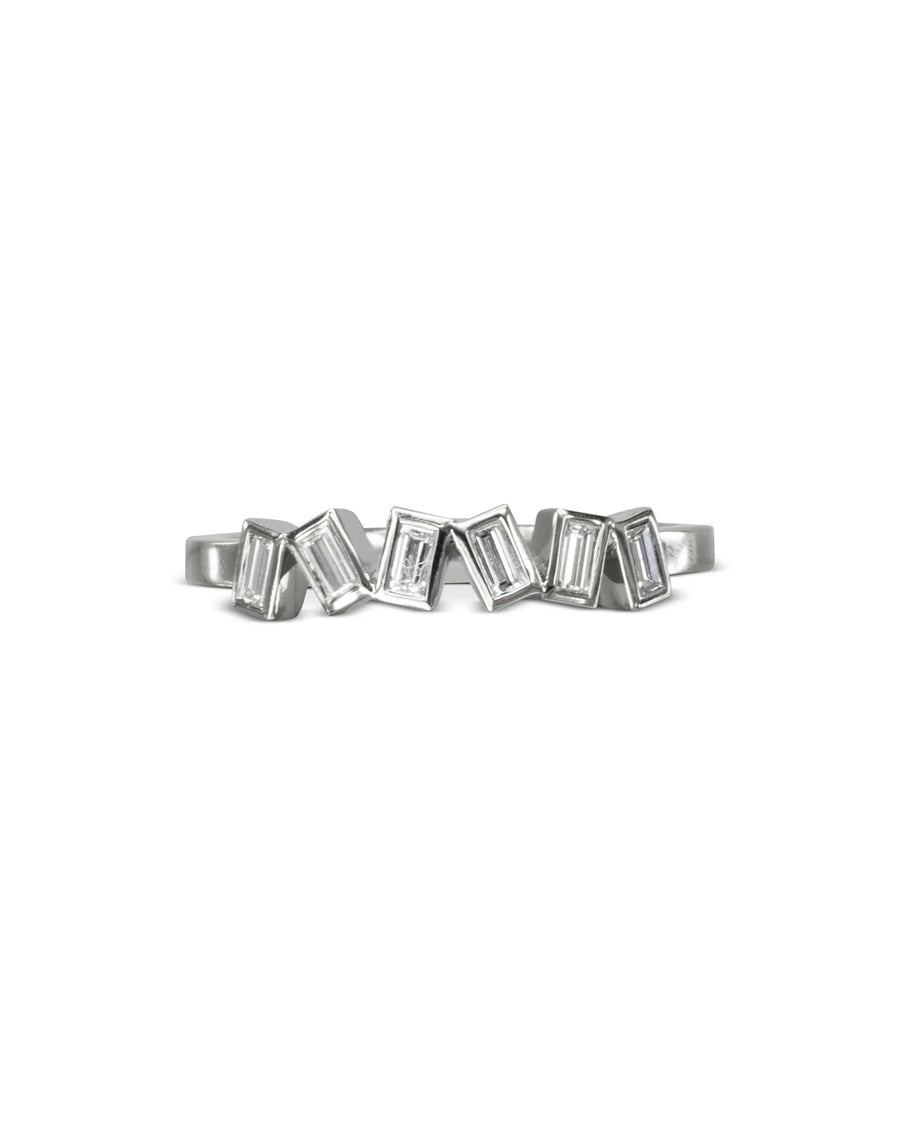 Silver half eternity ring with offset baguette diamonds.