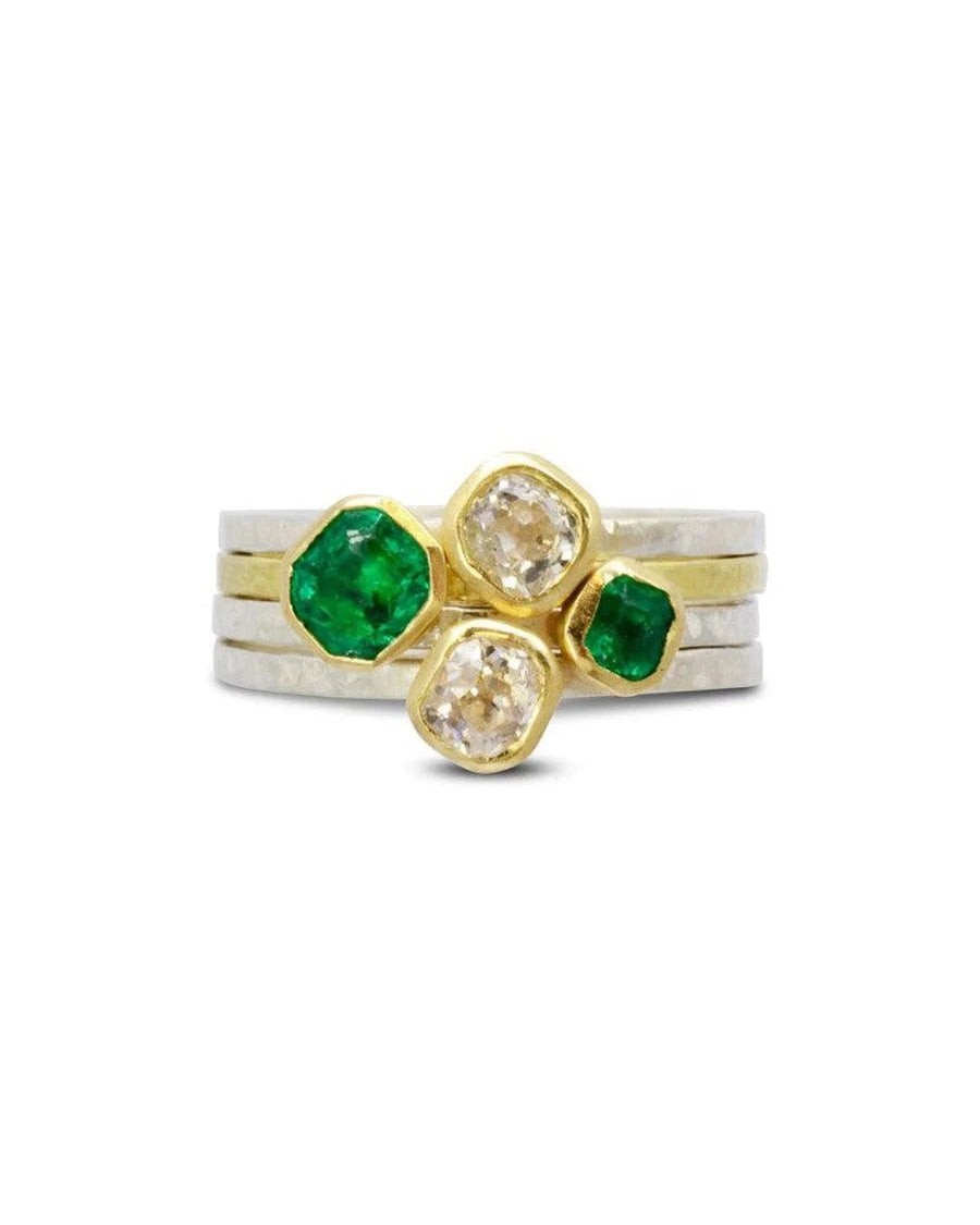stacking ring set with old cut diamonds and emerald stones in gold and silver