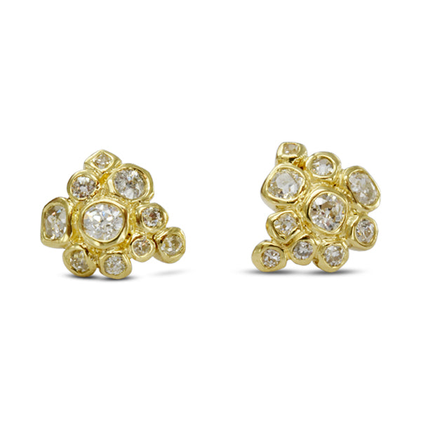 Gold cluster stud earrings with old cut diamonds.