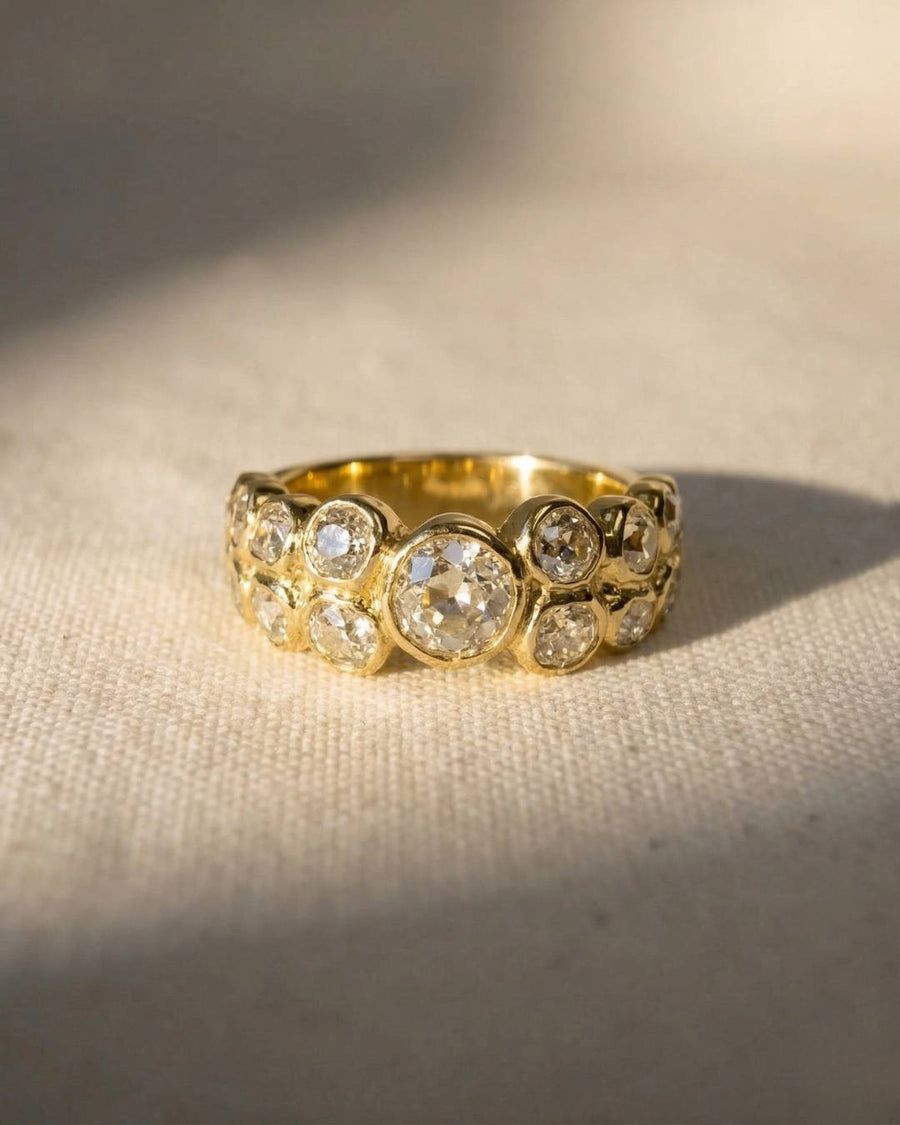9ct yellow gold eternity ring with bezel-set old cut diamonds.