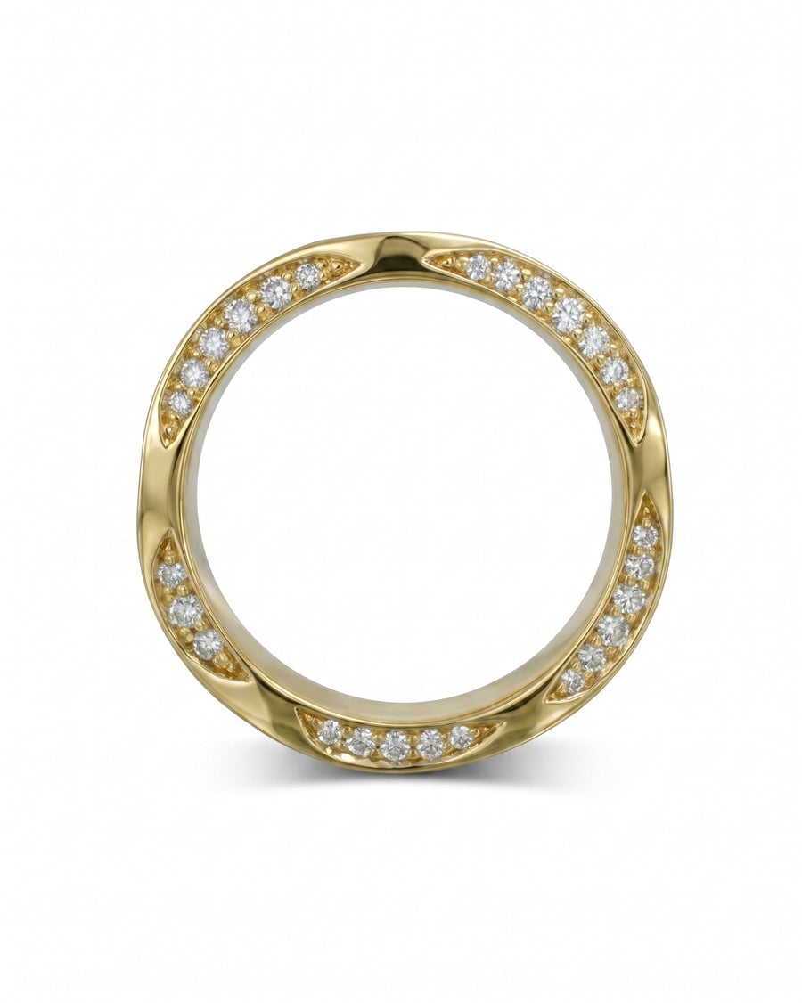 Gold eternity ring with diamonds and a twisted edge design.
