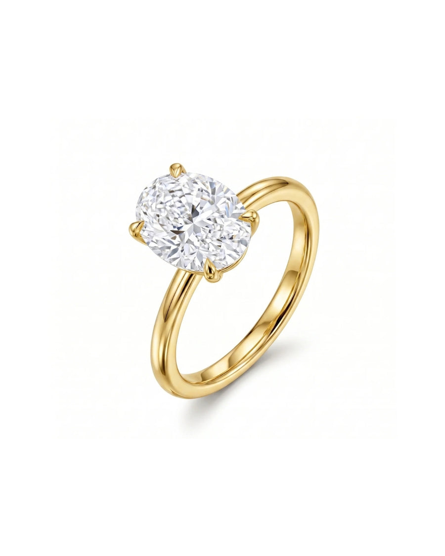 Yellow gold solitaire engagement ring with an oval diamond.