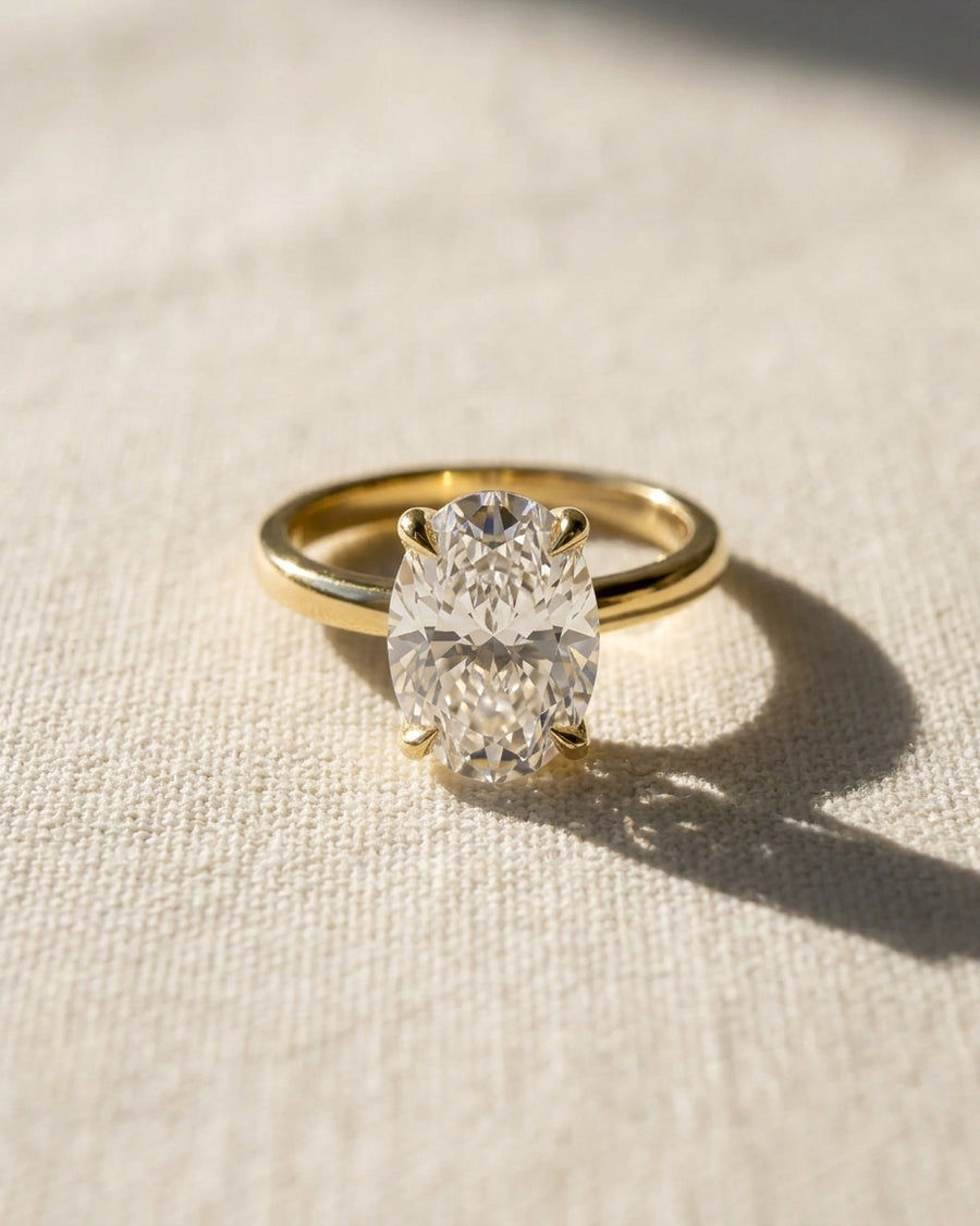 18ct yellow gold solitaire engagement ring with an oval diamond.