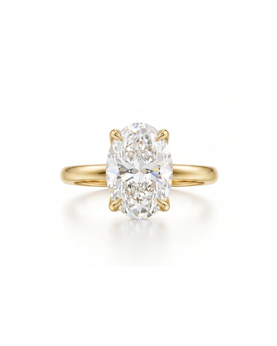 Yellow gold solitaire engagement ring with an oval diamond.