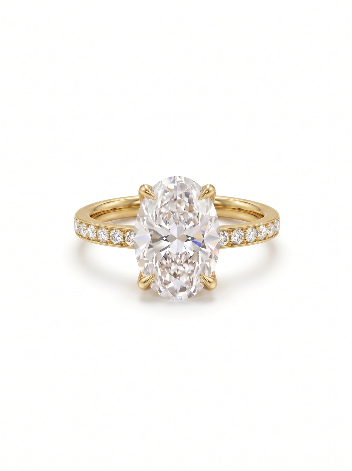 Oval diamond solitaire engagement ring in 18ct yellow gold with a pavé diamond band.