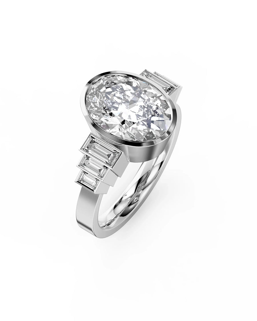 Platinum oval cut diamond engagement ring with baguette side stones.