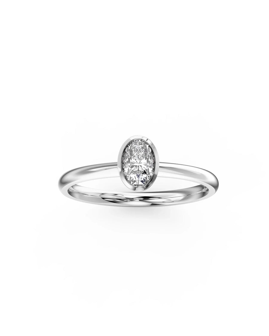 Silver oval cut bezel engagement ring with a single diamond.
