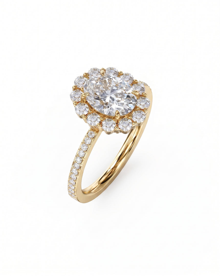 Yellow gold oval cut claw set halo diamond ring.