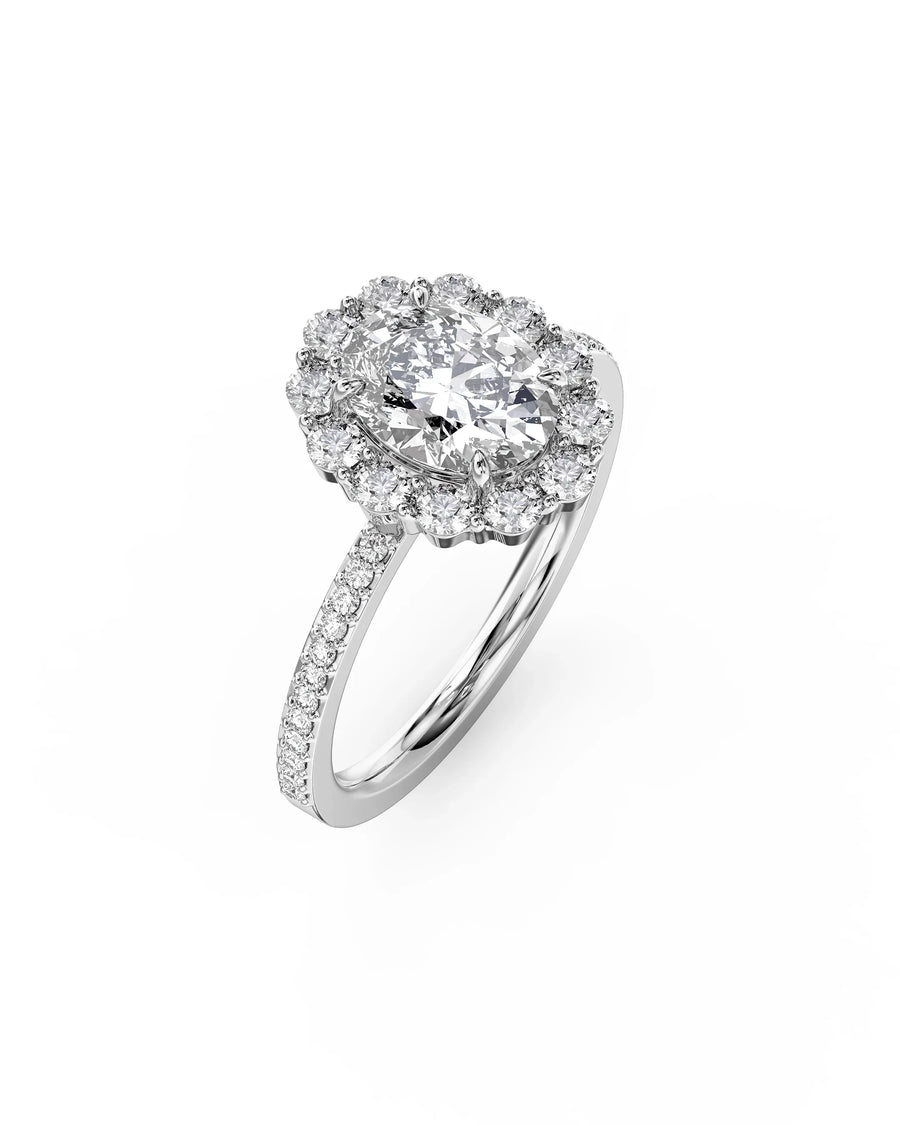 White gold oval cut claw set halo diamond ring.