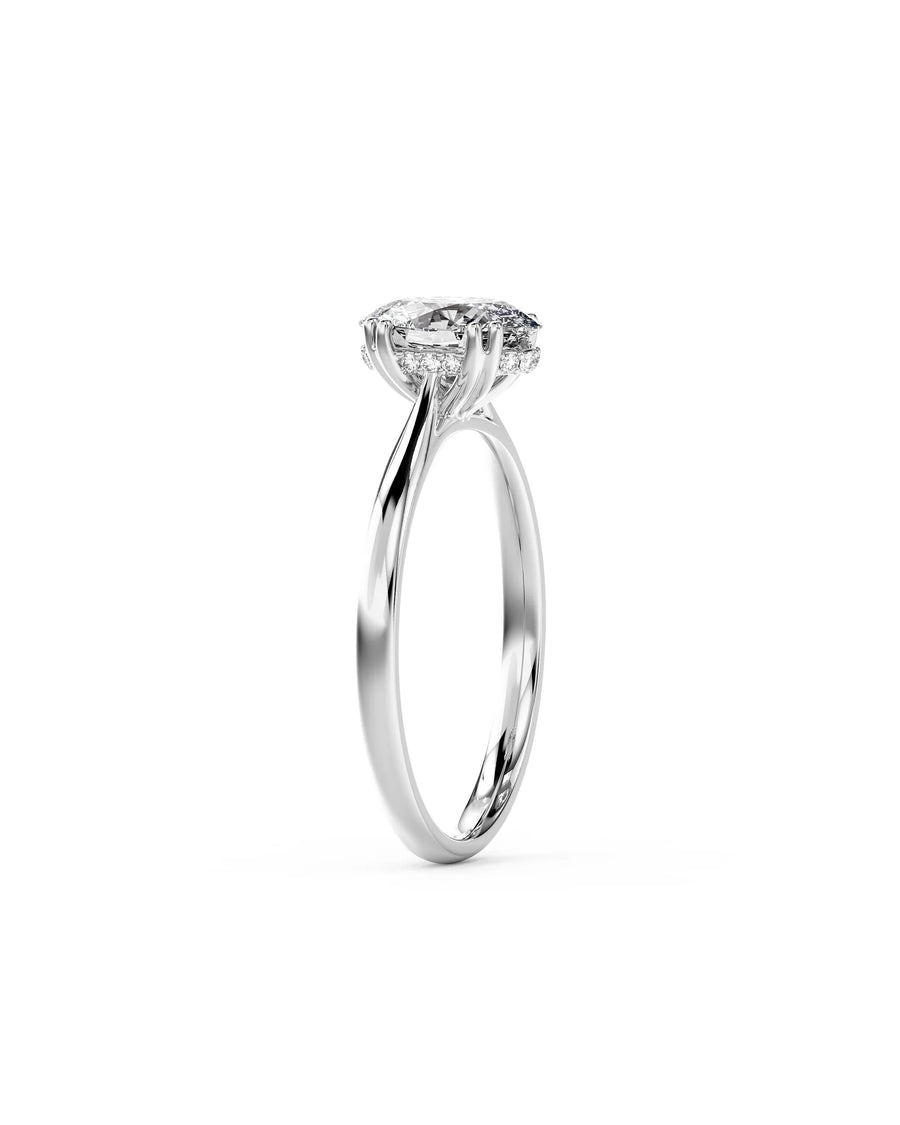 platinum engagement ring with an oval cut diamond and hidden halo.