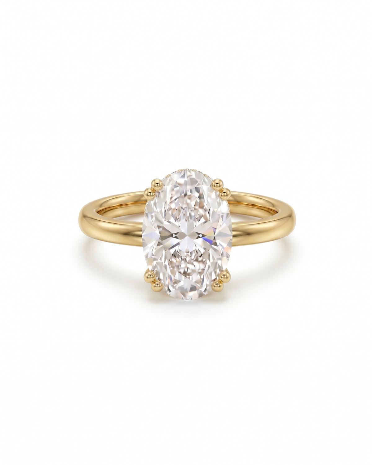 Oval cut diamond engagement ring with a hidden halo on a polished yellow gold band.