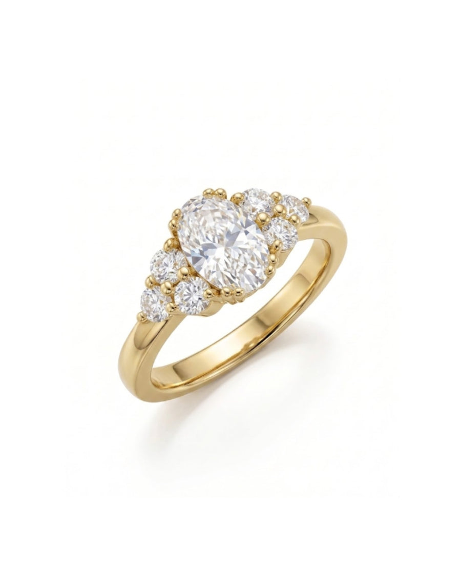Gold engagement ring with an oval cut diamond center stone and six round side diamonds.