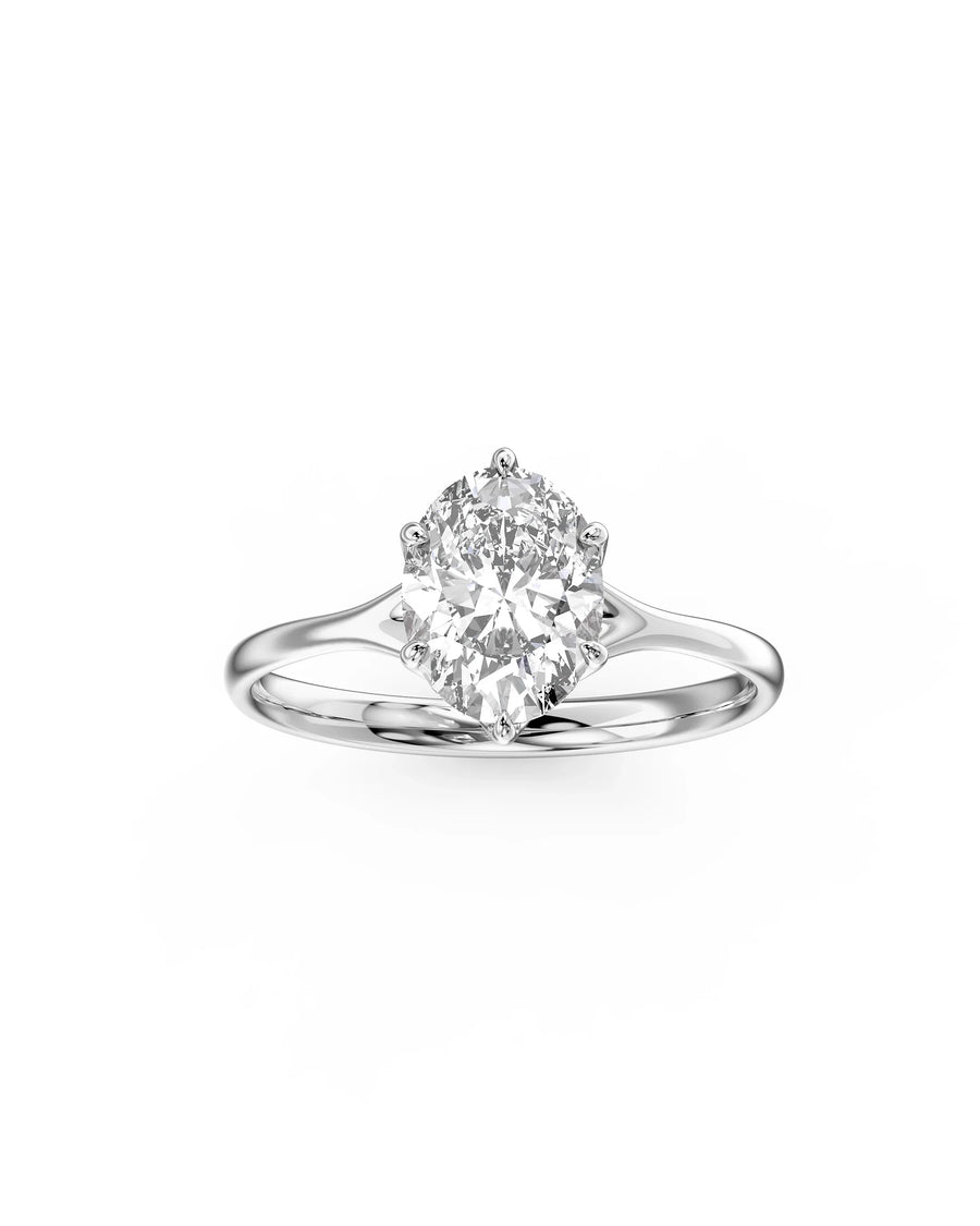 Oval cut diamond engagement ring in polished platinum with a six-prong tulip claw setting.